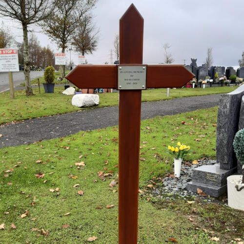 Iroko wooden memorial cross in a Belfast cemetery