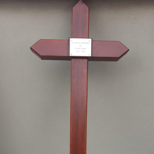Iroko cross mounted on a wall